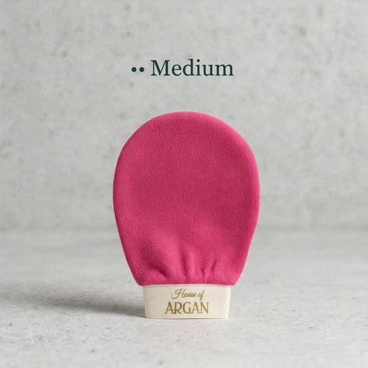 House of Argan fuchsia Moroccan kessa glove for medium body exfoliation, displayed upright on a neutral background