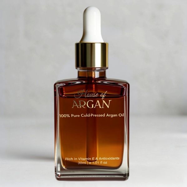 House of Argan 100% pure Moroccan argan oil dropper bottle on a light gray background