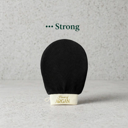 House of Argan black Moroccan kessa glove for strong body exfoliation, displayed upright on a neutral background
