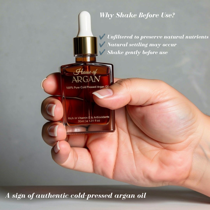 House of Argan 30ml 100% pure cold-pressed Moroccan argan oil bottle held in hand showing natural unfiltered oil